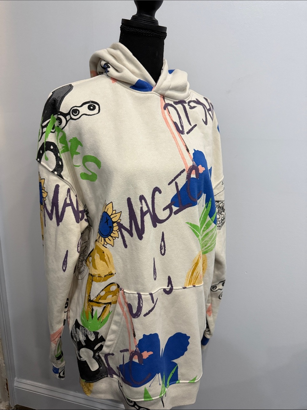 No Boundaries Cream Graphic Pullover Hoodie with Blue, Green & Yellow Accents